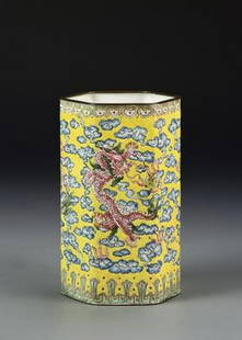 Antique Chinese Enameled Brush Pot: China, Qing Dynasty, enamel brush pot, octagon shaped body with plain white interior and base, decorated by pink dragon chasing through blue ruyi clouds on a yellow ground. Height 6 in., Width 3 5/8 i