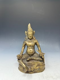 A statue of Jambhala, also known as Dzambhala, a prominent deity in Tibetan Buddhism