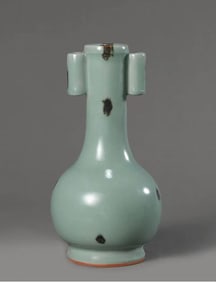A PLUM GREEN GLAZED DOTTED BROWN COLOR EAR VASE