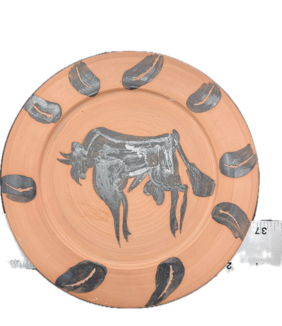 A hand-painted ceramic plate with a stamp of Pablo Picasso (1 of 4)