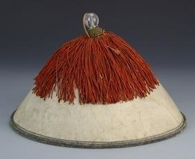 Chinese Qing Dynasty Officer's Hat: China, Qing dynasty, officer's hat with a crystal finial, mostly white, with a large amount of red fringe originating from the top. Diameter 12 3/4 in., Height 8 1/4 in.The Qing Dynasty (1644–1912)