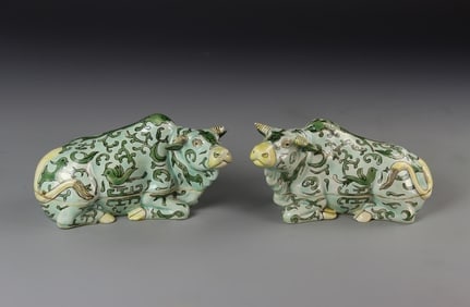 Pair of Antique Chinese Sancai Boxes in the Form of Cows: China, Kangxi Period, pair of Sancai boxes in the form of cows, each with a sea foam ground glaze, decorated with a lush green hued pattern of birds and plant life, minor chips and hairline crack. Pro