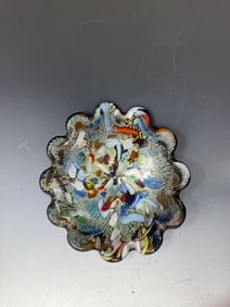 A vintage Murano "Tutti Frutti" art glass bowl: A vintage Murano "Tutti Frutti" art glass bowl. These bowls are known for their vibrant, multicolored designs, often featuring techniques like Murrine canes, Zanfirico white, Latticino with silver lea