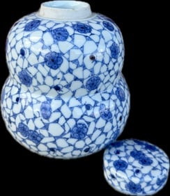 Antique Japanese blue and white ginger jar: Antique Japanese blue and white ginger jar, in a gourd form, minor chip on rim, 7 3/4” high