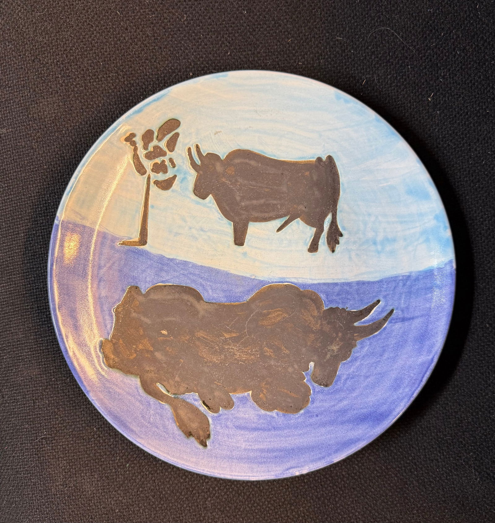 A ceramic plate with a print name of Picasso On the back (1 of 4)