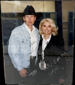 A signed photograph of actor Bruce Boxleitner with a woman (1 of 3)
