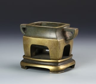 Antique Chinese Brass Censer: China, 19th C brass censer, thick rimmed mouth, simplistic lines, two ears, four stout legs on a flat round base which is marked. Height 4 in.