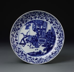 Antique Chinese Blue and White Plate: China, 19th C., blue and white plate, interlocking floral pattern bordered around the interior rim, with central emblem depicting a garden landscape with trees and bridges in dark blue against white g