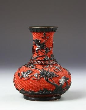 Antique Chinese Cinnabar Vase: China, 19 th C, cinnabar vase, upward turn rim at mouth, short neck, bulbous body on footed base, black raised vine decoration with red crisscross design ground. Height 6 3/4 in.