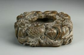 Antique Chinese Carved Brush Washer: China, carved brush washer, round body on flat base in natural wood colors carved to form fish within underwater vegetation and leaves, plain underside. Diameter 5 1/4 in., Height 1 1/2 in.
