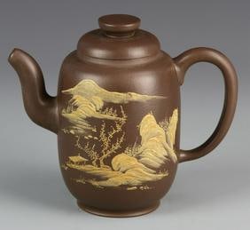 Antique Chinese Qing Period Yixing Teapot: China, Qing period, Yixing teapot, with a tall, elongated form, large ear-formed handle, swooping spout, lid and flattened finial, the body of the teapot decorated with an expressively balanced mounta