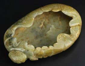 Antique Chinese Lotus Form Jade Brush Washer: China, Yuan/Ming Period, jade brush washer in a form of lotus flower, with a smooth, rounded surface and striated coloration. Length 6 1/2 in., Width 4 1/2 in.