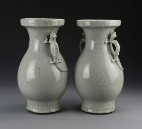 Pair Of Antique Chinese Crackle-Glazed Vases: China, 19th C., a pair of crackle-glazed vases, with platform bases, bulbous bodies, two decorative handles, in a light grey hue, with high shine surface. Height 13 1/2 in.