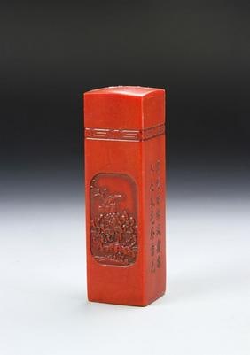 Chinese Red Stone Seal Chop: China, red stone seal chop, in a long, rectangular form, intricately incised with floral motifs, Chinese characters and a ring of geometric forms, in a rich red hue. Height 4 1/2 in.