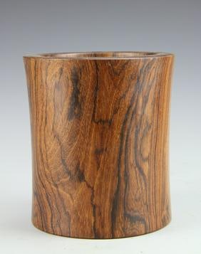 Antique Chinese Huanghuali Hardwood Brush Pot: China, antique Huanghuali Hardwood Brush Pot, with thick walls flaring slightly outward, in a natural light shade with dark grain patterns visible. Height 6 7/8 in., Diameter 6 in.