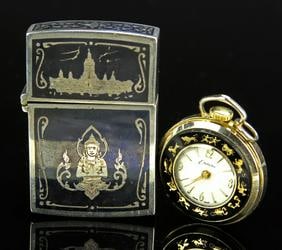 Two Thai Silver Items: Thailand, one silver box and one pocket watch in working condition, the box decorated with Buddhist elements and the pocket watch decorated with Zodiac symbols around the face. Length 2 1/4 in.