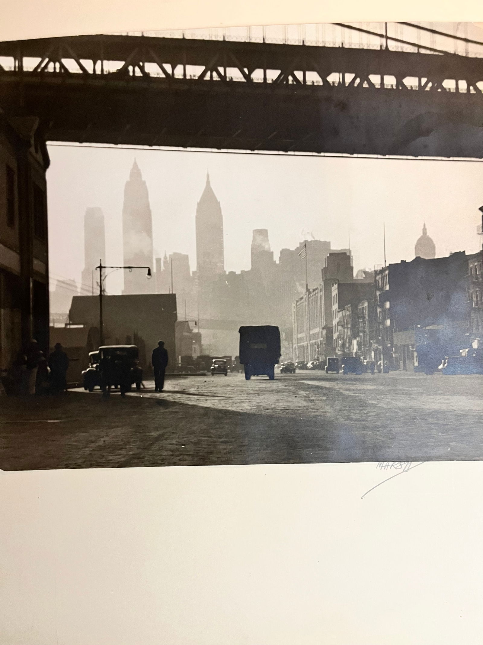 Photograph under the Brooklyn Bridge 1920s large format: Photograph of under the Brooklyn Bridge 1920s during the depression looking out at the skyscrapers ahead condition. Good Silvertone photo sign on bottom right measurements are 10 x 12.