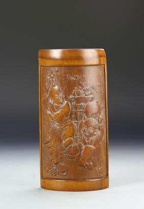 Antique Chinese Bamboo Wrist Rest: China, ROC Period, bamboo wrist rest, smoothed and rounded edges with a border, central carving depicting young figures playing with urns and vases. Width 9 3/4 in., Height 4 3/4 in.