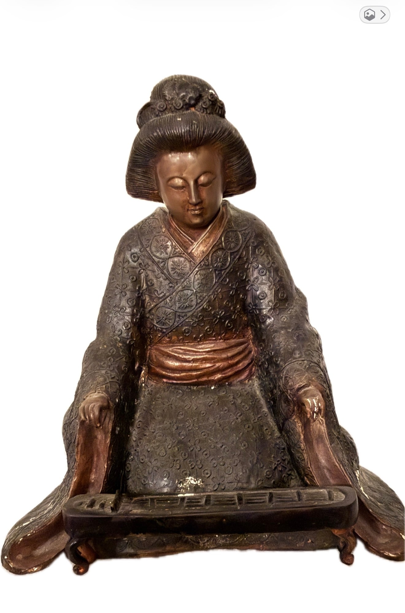 A Japanese bronze statue depicting a female musician playing a koto.: A Japanese bronze statue depicting a female musician playing a koto, 14 1/2” x 11 1/2”