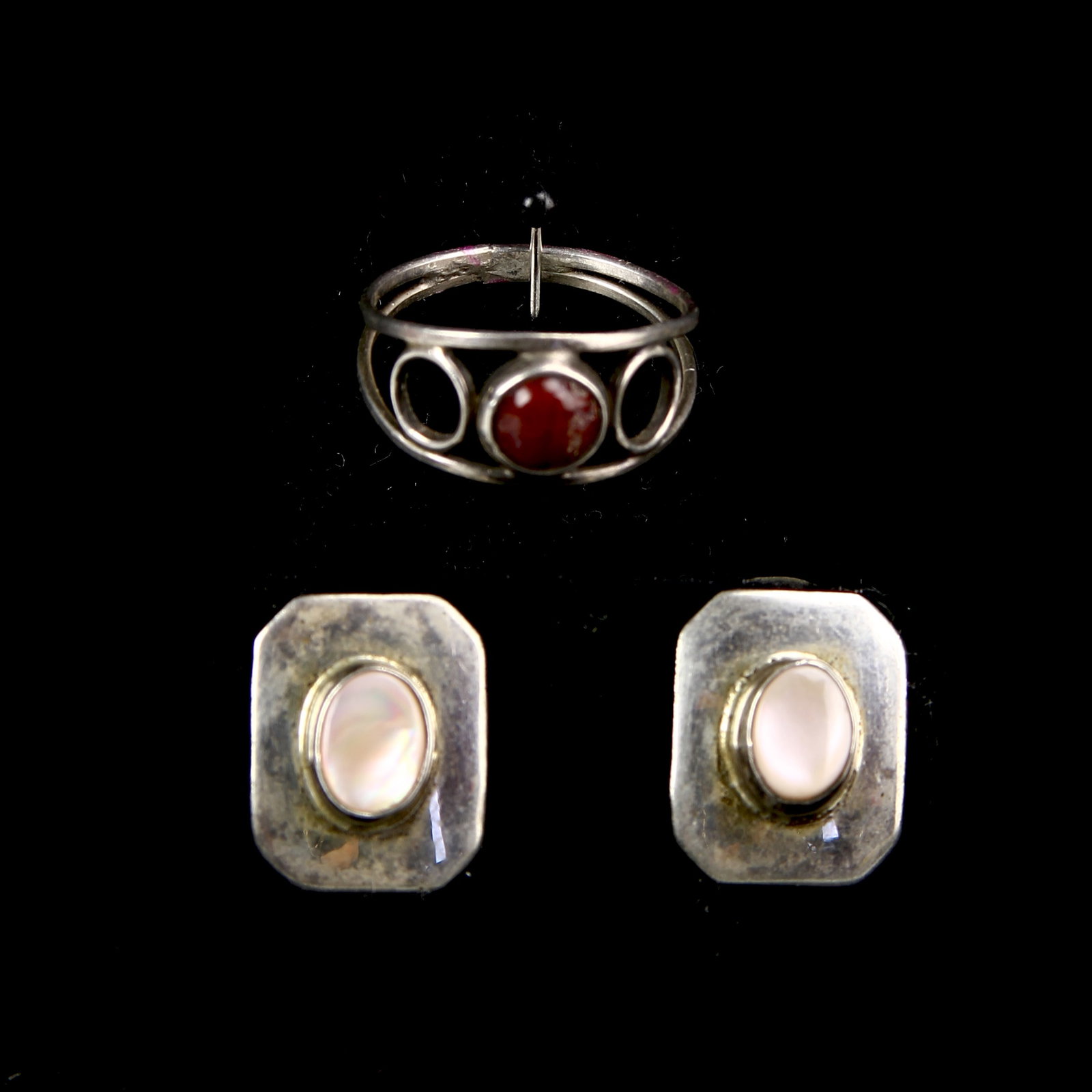 Silver Ring and A Pair of Silver Earrings: Silver ring and a pair of silver earrings with inlays.