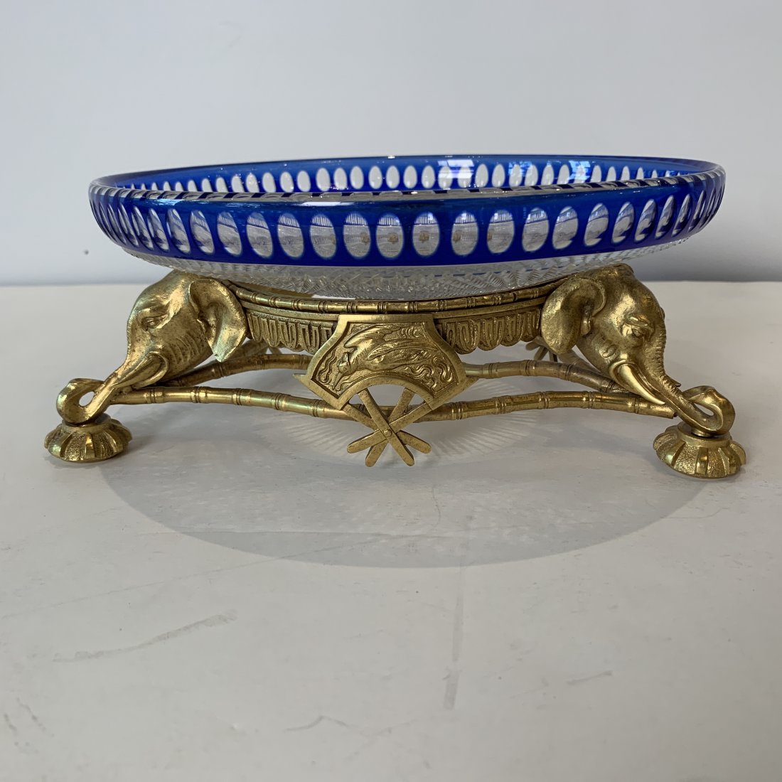 Early 20th C. Val Saint Lambert Hand Cut Centerpiece: Early 20th C. Val Saint Lambert hand cut centerpiece bowl on a gold gilt footed bronze elephant motif base, Very good condition 11”diameter X 4”H