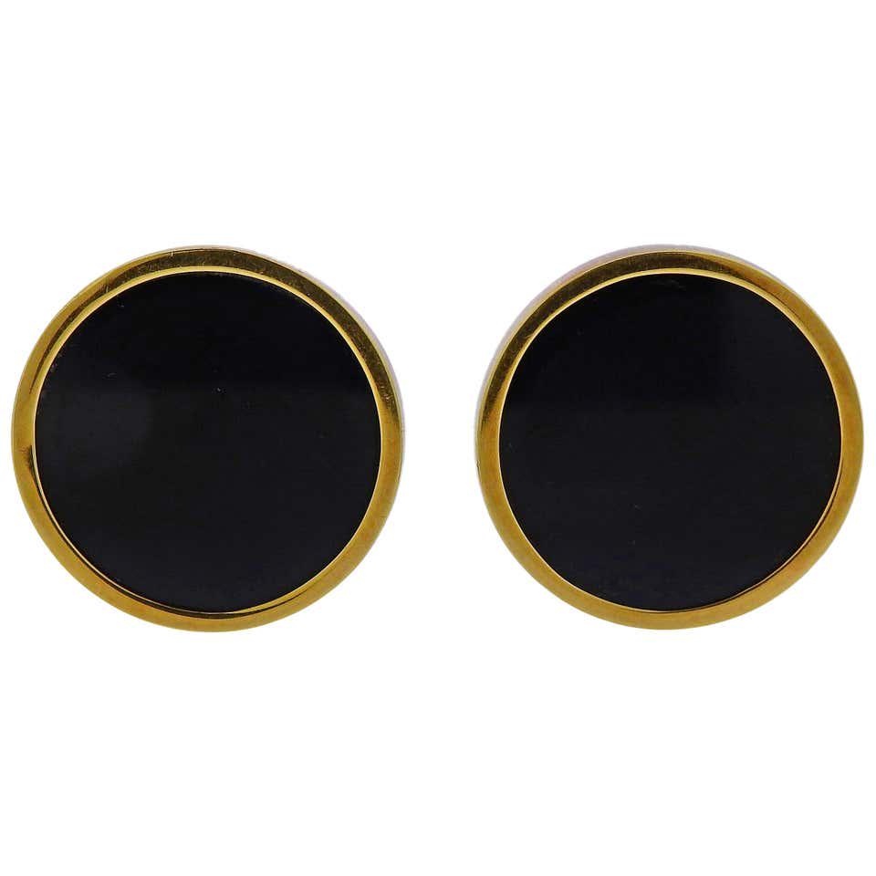 Andrew Grima Onyx 18k Gold Earrings: Pair of 18k yellow gold round earrings by Andrew Grima, set with black onyx. Earrings are 23mm in diameter. Weigh 19 grams. Grima, 750, English marks.