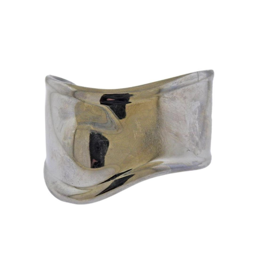 Tiffany & Co Peretti Charcoal Finish Bone Cuff Bracelet: Iconic bone cuff bracelet by Elsa Peretti for Tiffany & Co, in charcoal finish ruthenium over copper. Cuff will fit up to 7" wrist and is 39mm wide. Marked: Tiffany & Co, Elsa Peretti, Italy. Weight -