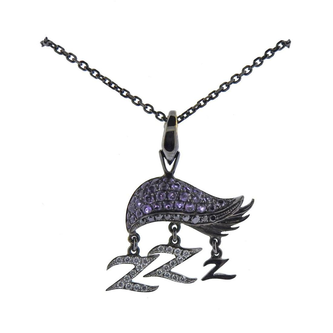 Stephen Webster Sloth Diamond Gemstone 18k Gold: 18k blackened gold necklace by Stephen Webster, depicting sloth, with Z letter charms. Decorated with diamonds and pink gemstones. Necklace is 17" long, pendant is 30mm x 21mm. Marked: SW 750. Weight