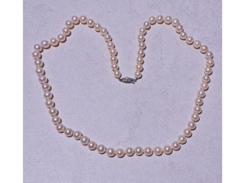 Mikimoto 7-7.5mm Pearl Necklace: Mikimoto Pearl Necklace. Pearls range from 7-7.5mm in diameter. Pearl on clasp is 3mm. Necklace is 23" long. Marked - M, Sil. Weight - 38.5 grams.