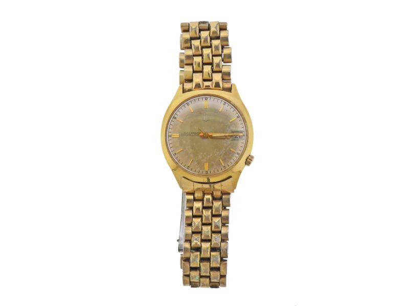 Bulova Accutron 14k Gold Steel Watch: Vintage Bulova Accutron 14k gold and stainless steel watch. Band is gold tone steel, shows stretching. Case - 33mm excl crown. Scratches on the crystal. Gold tone dial signed Accutron, with date at 3