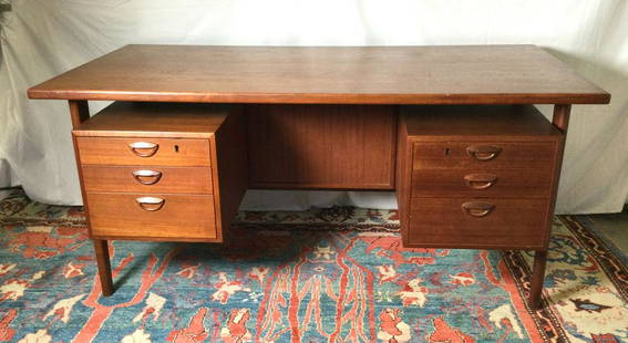 1960’s Kai Kristiansen Desk for Feldballes: 1960’s Kai Kristiansen Desk for Feldballes Mobelfabrik. Age appropriate wear from use. 60” wide by 30 1/2” deep by 28 1/2” tall. Draws on one side shelving on other. Please no