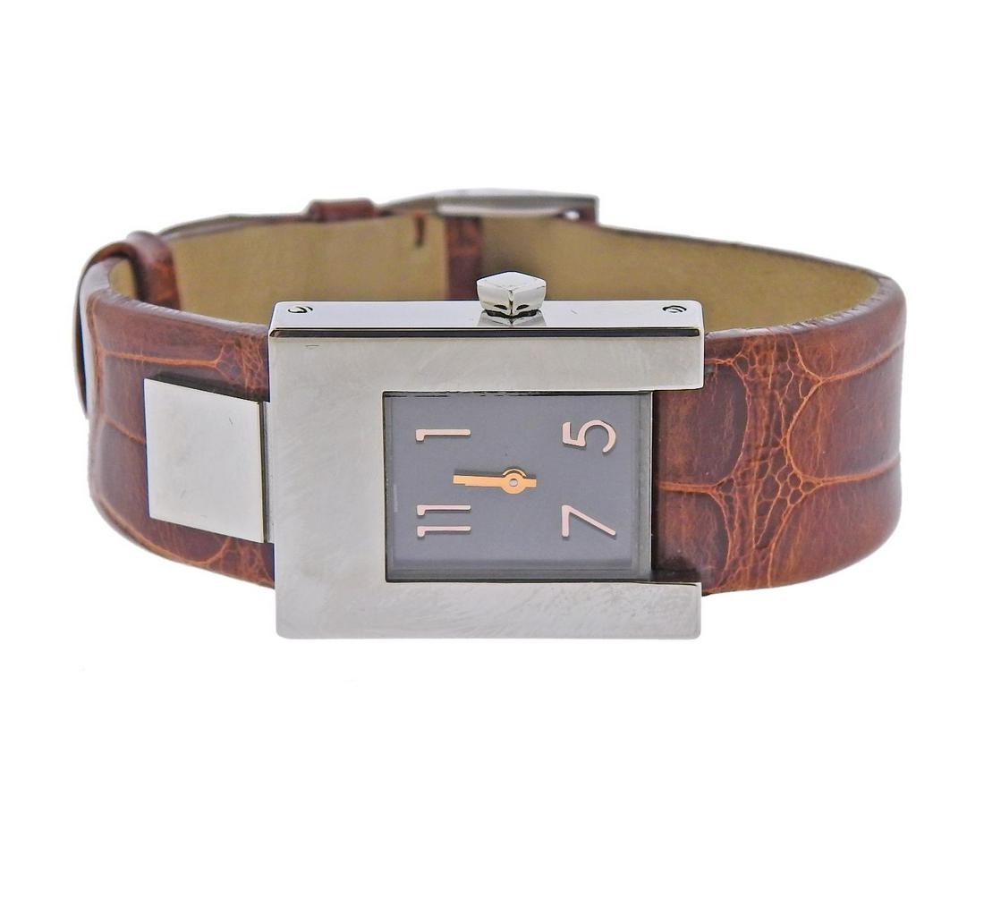 Pomellato Silvered Dial Brown Leather Lady: Unworn Pomellato lady's watch in stainless steel, with silvered dial and brown leather band. Quartz movement -running. Retail $2550. Case - 22mm x 28mm. Band is 7.5" long.