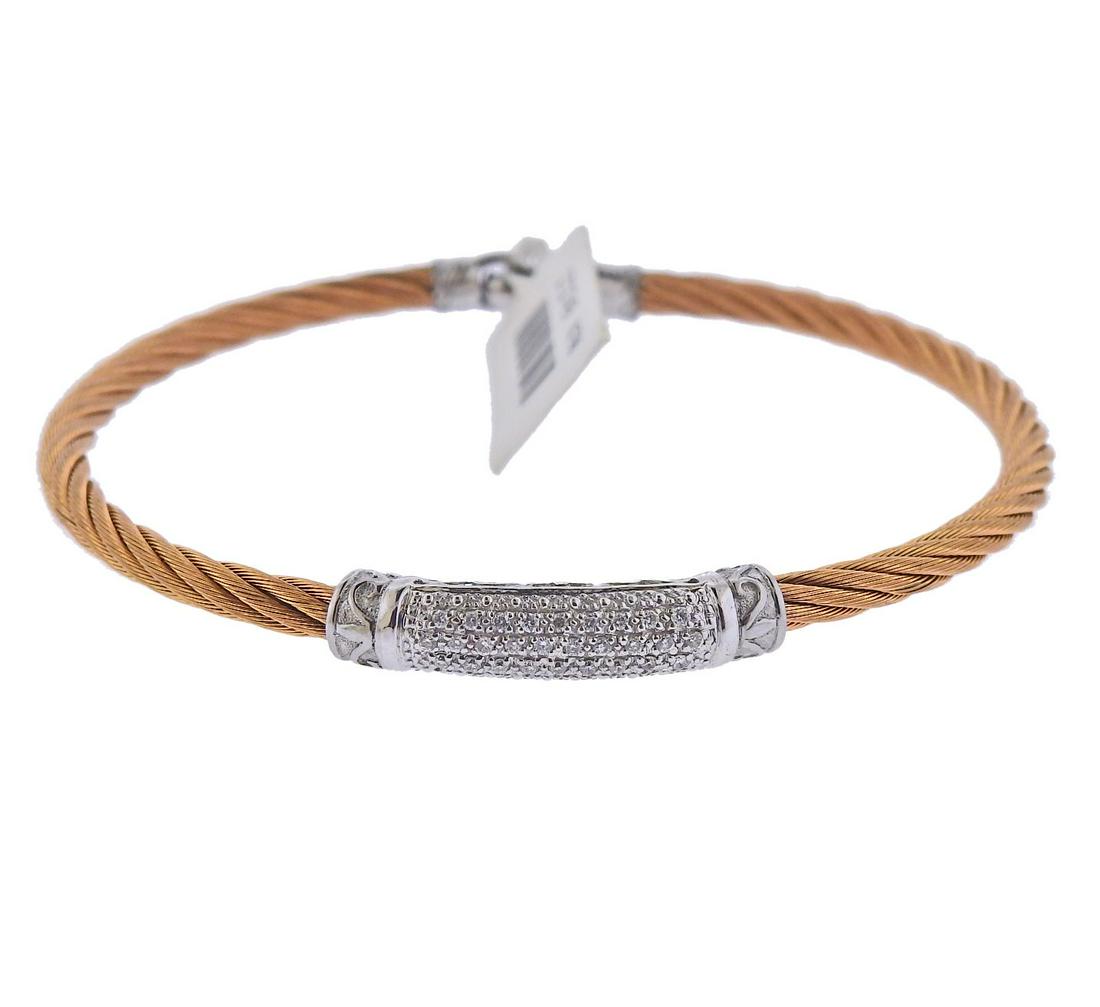 Charriol Rose Tone Steel 18k Gold Diamond Bracelet: New with tag, Charriol bracelet in rose tone steel and 18k gold, with approx. 0.12ctw in diamonds. Bracelet will fit up to 6.5" wrist and i 5.3mm wide. Marked: Charrio, Au750, Steel. Retail $995. Weig