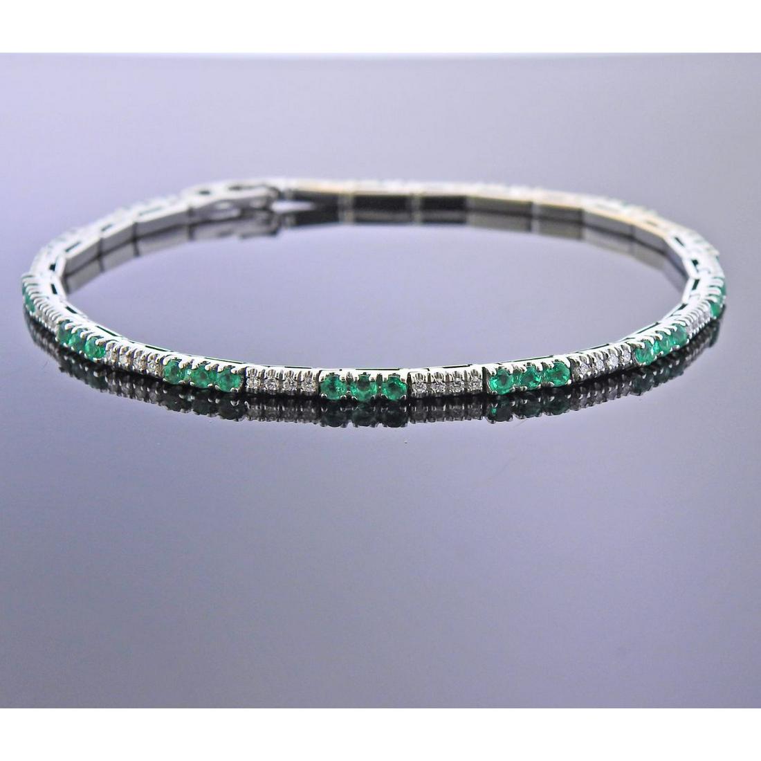 18k Gold Diamond Emerald Line Bracelet: 18k white gold line bracelet, with approx. 0.26ctw in diamonds and emeralds. Bracelet is 7.5" long and 2.4mm wide. Marked: 750, Gold mark. Weight - 11.2 grams.