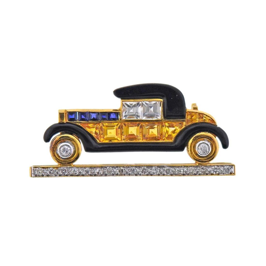 18k Gold Diamond Sapphire Enamel Vintage Car Brooch: 18k gold vintage car brooch, set with approx. 0.20ctw in diamonds, yellow and blue sapphires and black enamel. Brooch is 32mm x 15mm. Marked: 18k. Weight - 3.8 grams.