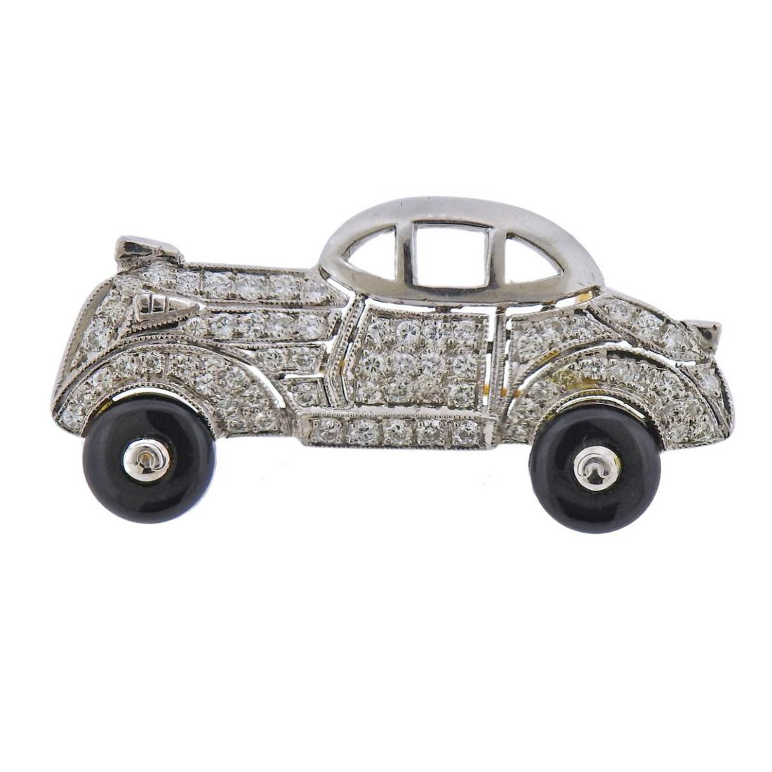 18k Gold Diamond Enamel Vintage Car Brooch: 18k gold vintage car brooch, with black enamel wheels and approx. 0.52ctw in diamonds. Brooch is 39mm x 20mm. Tested 18k. Weight - 7.3 grams.