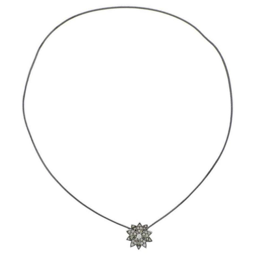 Van Cleef & Arpels Diamond Gold Lotus Pendant Necklace: 18k white gold Lotus pendant necklace, crafted by Van Cleef & Arpels, decorate with approx. 0.46ctw ni FG/VVS diamonds. Retail $10300., comes with pouch. Necklace is 15 3/4" long, Pendant is 17mm x 17
