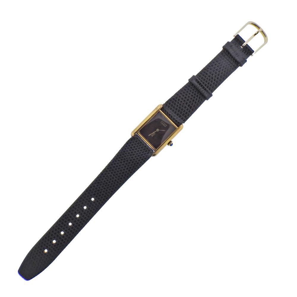 Must de Cartier Tank Vermeil Manual Wind Watch: Vermeil case Tank Cartier watch, with burgundy dial, manual wind movement in working order. Case - 24mm x 30mm, sapphire crown. Band and buckle not original.