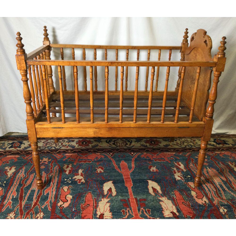 Beautiful Birdseye Maple Crib: 46" long x 28" wide x 411/2" tall. One side comes down. Wear consistent with age and use.