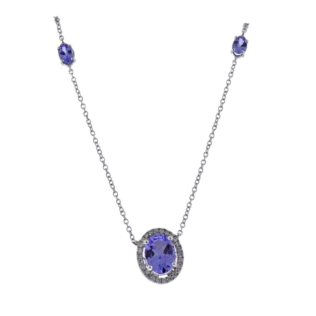 Kallati White Gold Tanzanite Diamond Pendant Necklace: 9k white gold chain with pendant by Kallati. Necklace is 18" long, pendant - 11mm x 9mm. Set with tanzanites and approx. 0.15ctw in diamonds. New with tag. Retail approx. $1645. Marked: 375 Kallati. W