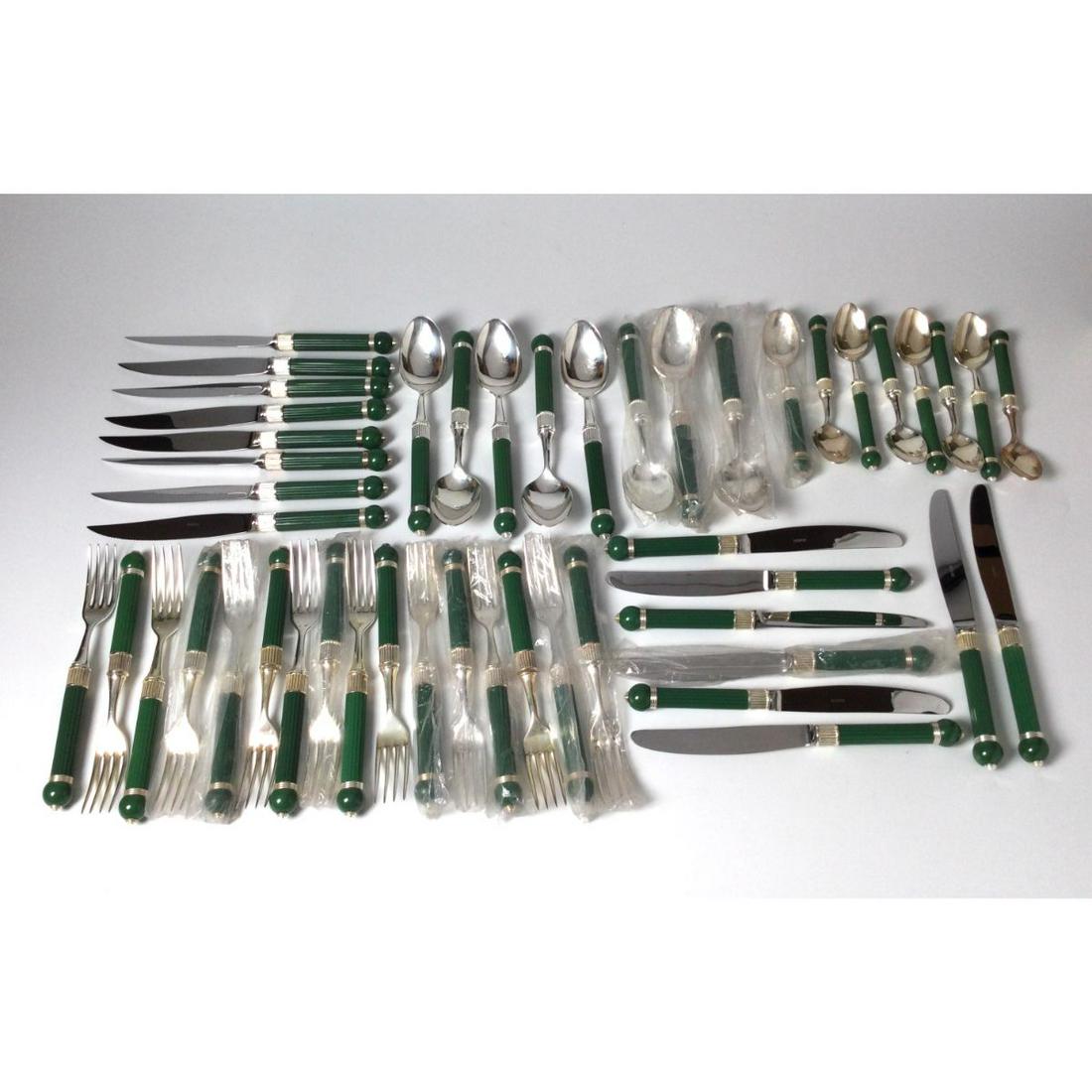 Gucci Flatware Service Setting for 8: 16 forks, 8 knifes, 8 steak knives, 8 teaspoons, 8 tablespoons. Some in original plastic.