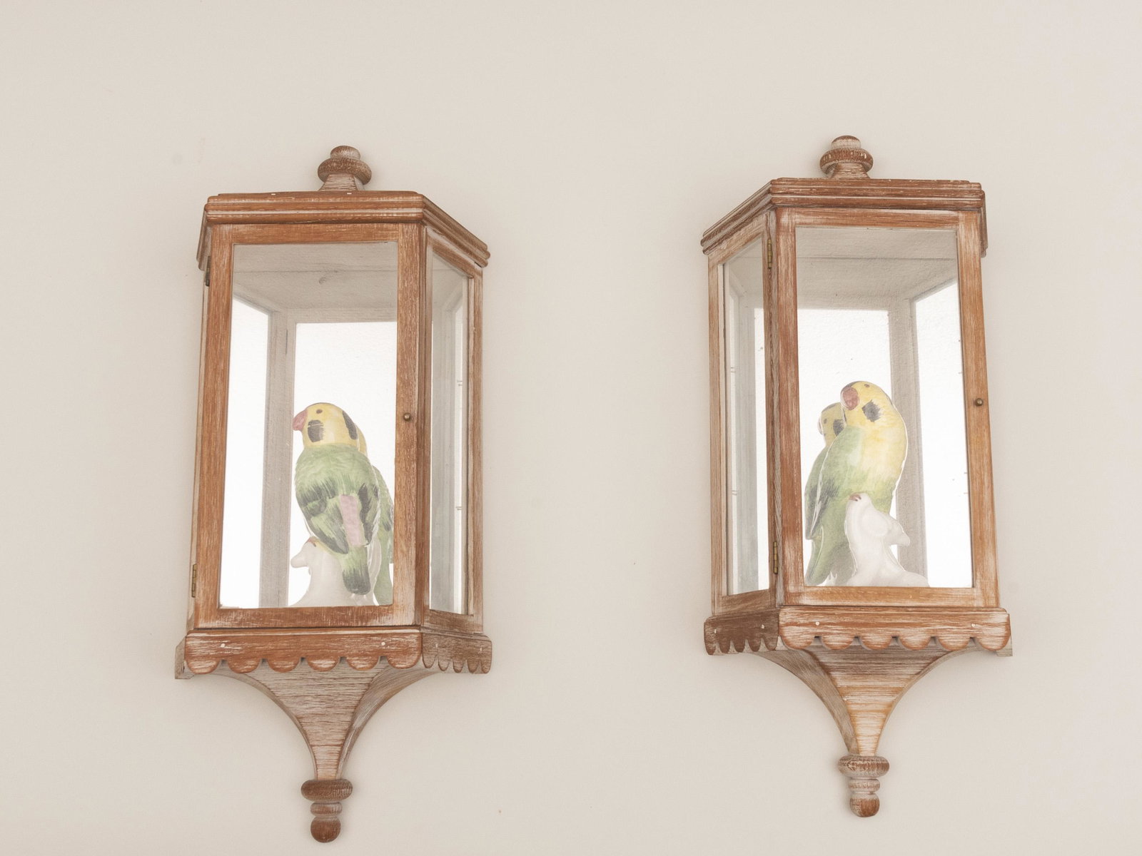 A Pair of Italian Hand Painted Birds in Mirrored Wall: A Pair of Italian Hand Painted Birds in Mirrored Wall Mounted Wooden Cabinets Height of birds: 6 inches; Overall height: 20 inches