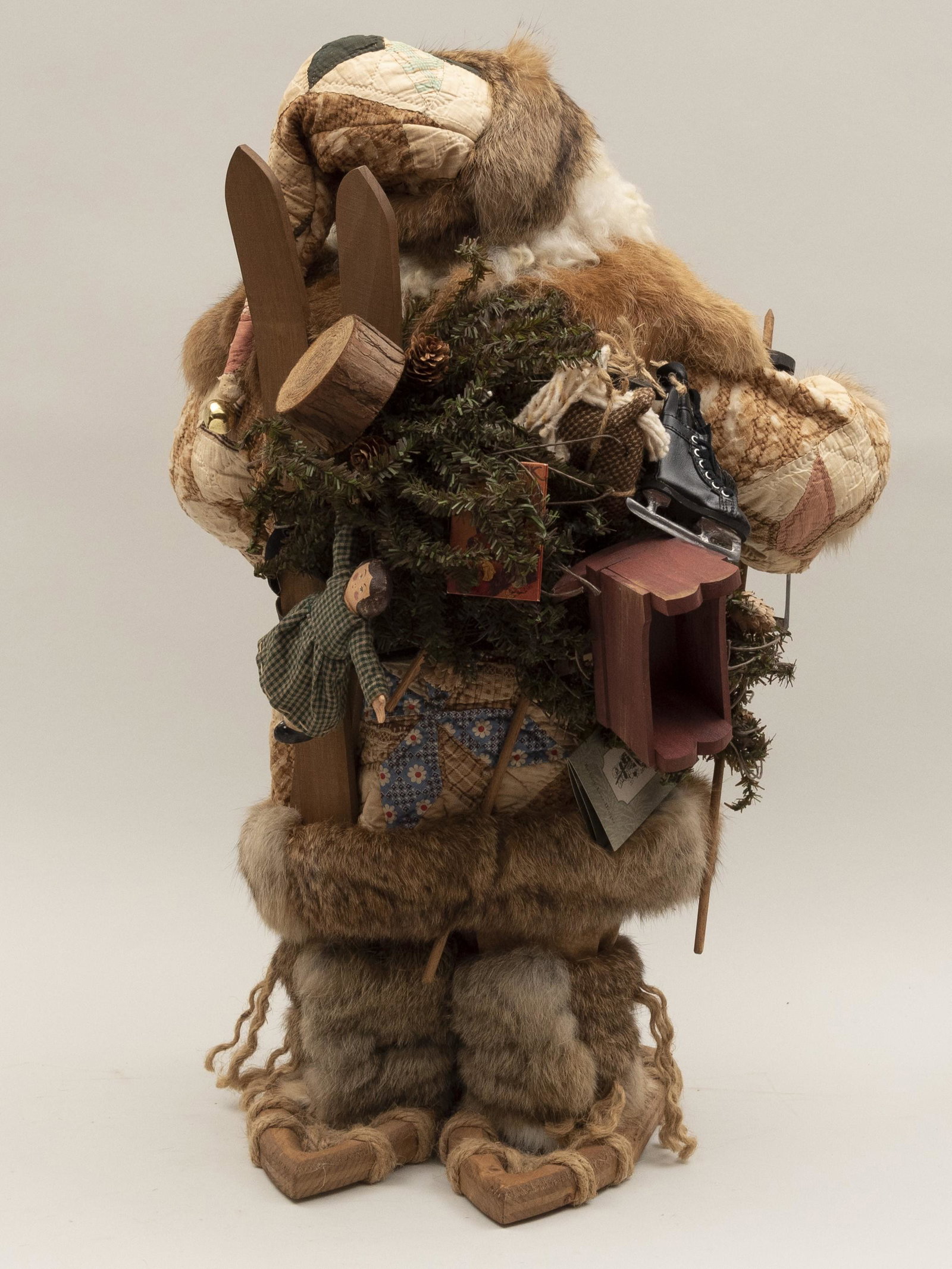 Bethany Lowe Handmade Signed Santa Claus Height: 27: Bethany Lowe Handmade Signed Santa Claus Santa is outfitted with snowshoes wearing a fur-trimmed coat and holding a lantern and teddy bear with skis and toys on his back. Height: 27 inches