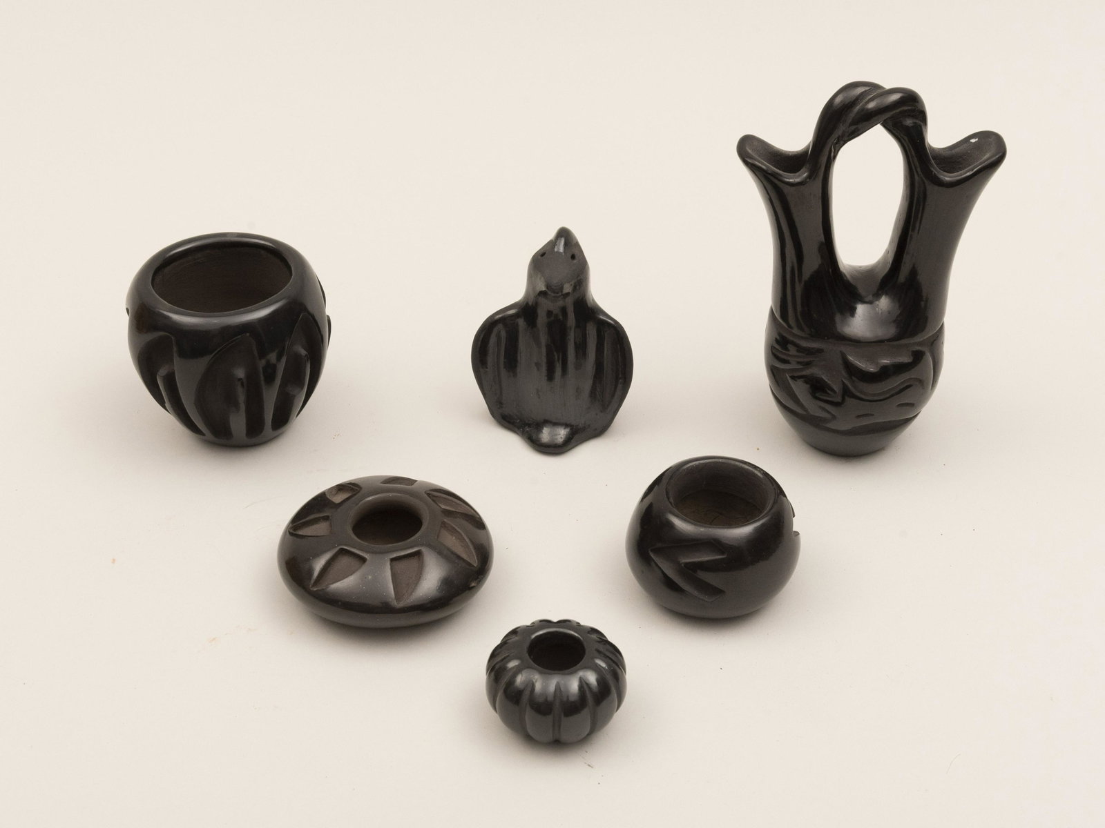 Select Group of Small Santa Clara Carved Blackware: Select Group of Small Santa Clara Carved Blackware Pottery A wedding vase signed Jane and Starr seed pot by Johanna Herrera three pots by Annette Ortega Celestina Naranjo and Leona Baca and a bird fig