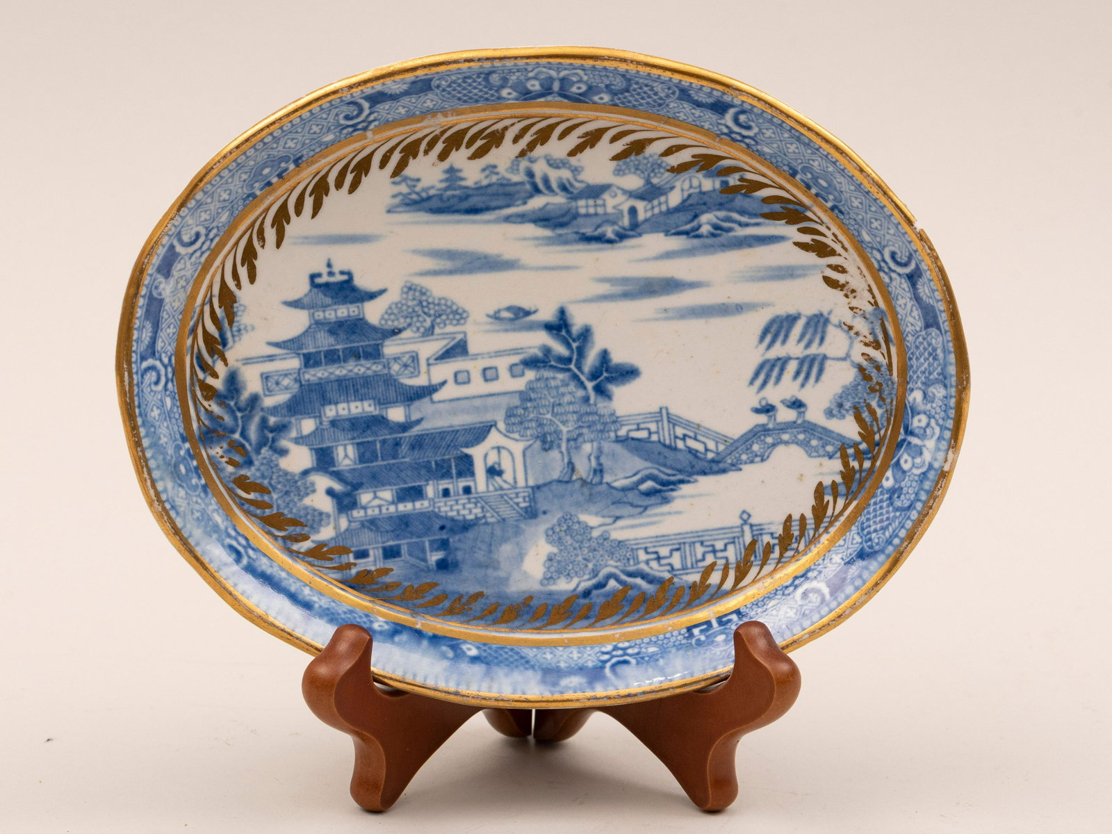 Early Spode, circa 1800 Pagoda Pattern Porcelain Tea: Early Spode circa 1800 Pagoda Pattern Porcelain Tea Service Twenty-four pieces of gilt decorated blue and white porcelain to include teapot two sugars (one covered) creamer nine teacups of two styles 
