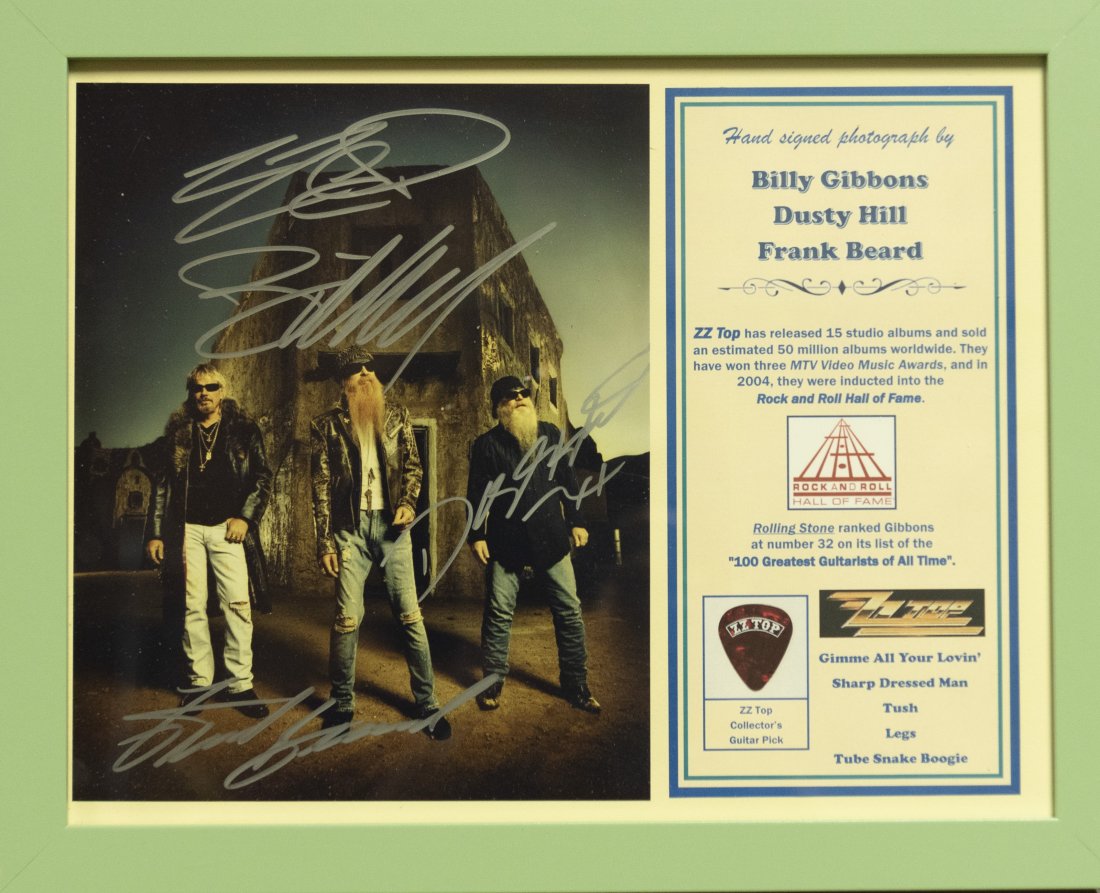 ZZ Top Signed Photo And Pick 11 x 14 inches: ZZ Top Signed Photo And Pick Hand signed photo by all three members of ZZ Top: Billy Gibbons Dusty Hill and Frank Beard fifteen top selling albums amassing 50 million sold. Many honors including Hall 