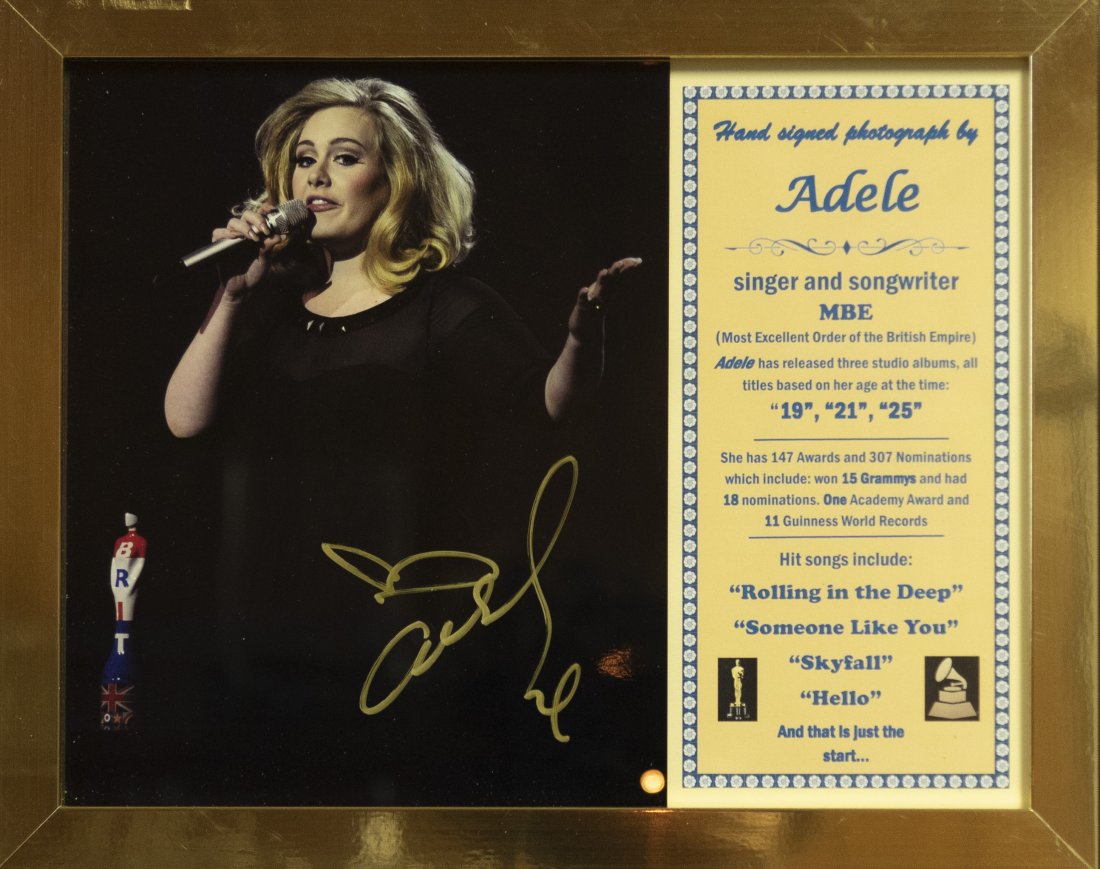 Adele Signed Photo 11 x 14 inches: Adele Signed Photo Hand Signed concert photo by Adele singer and songwriter so beloved and admired winning 15 Grammy's an Academy Award and 11 Guinness World Records. Her songs "Hello" and "Rolling In