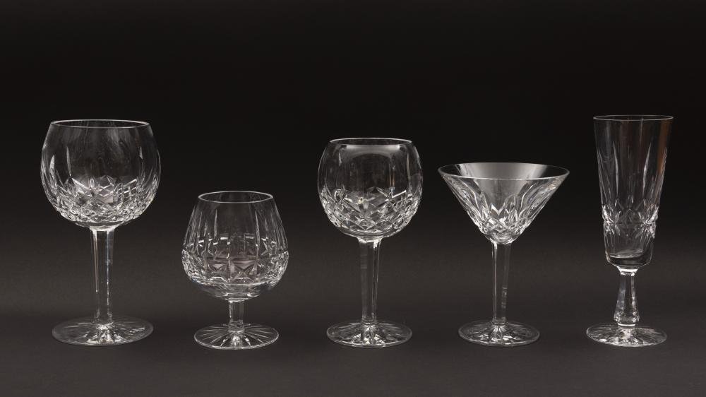 Collection of Waterford Crystal Stemware: To include: 14 red wine glasses, 3 martini glasses, 9 champagne flutes, 4 brandy snifters, and 5 white wine glasses.
