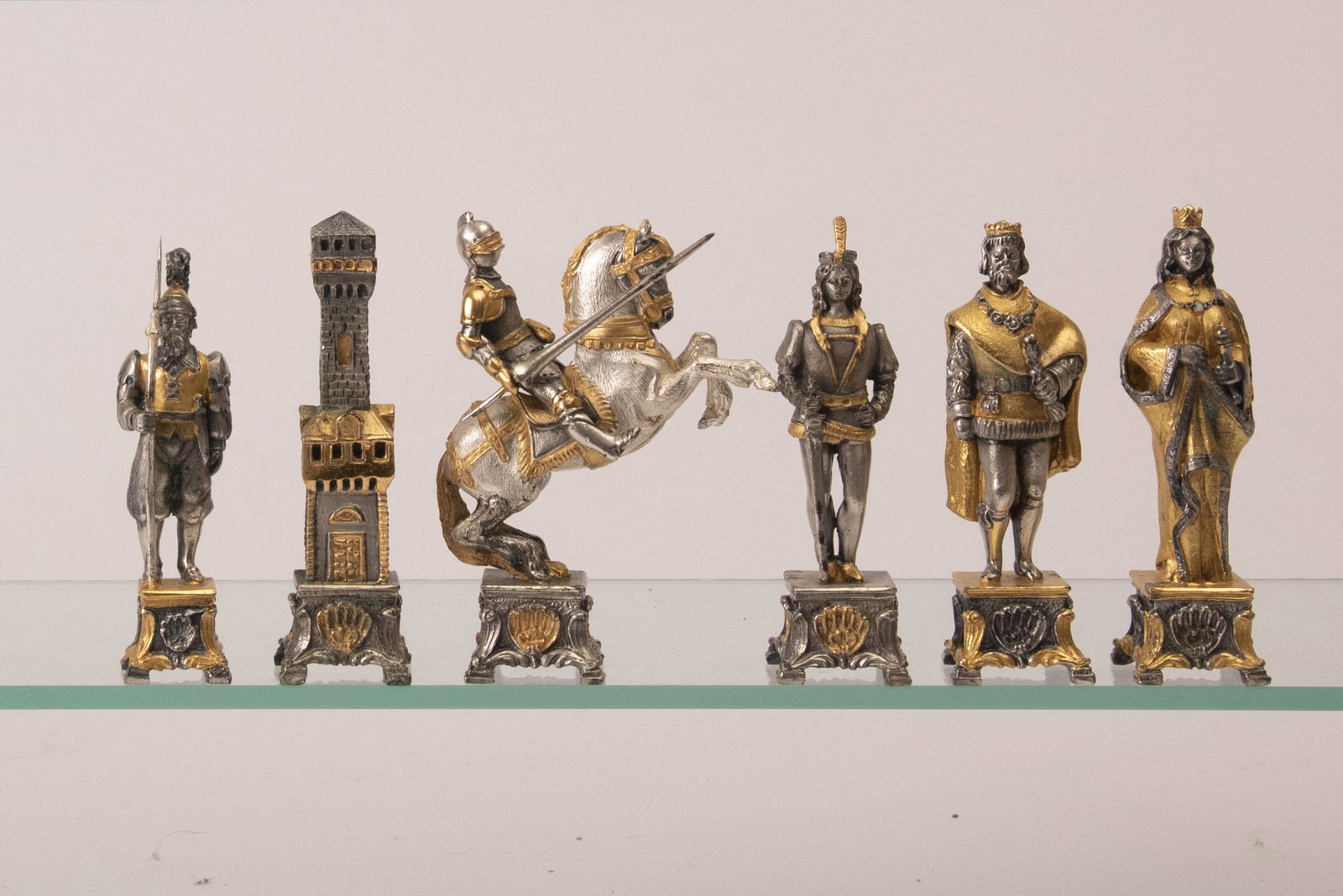 Piero Benzoni, Italian (20th Century) 24k Gold and: Piero Benzoni, Italian (20th Century) 24k Gold and Silver Plated Bronze Medieval Chess Set 32-piece set plated in 24k gold and silver. Height of tallest piece: 4 1/2 inches