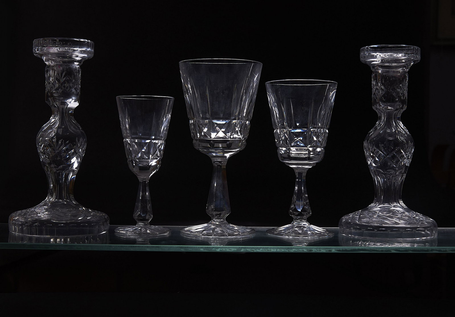 Waterford Stemware Collection: Waterford Stemware Collection Crystal stemware including twelve wine glasses, eleven water glasses, five liquor glasses, and two candle sticks. Stamped Waterford. From the Collection of Nadine Selkirk